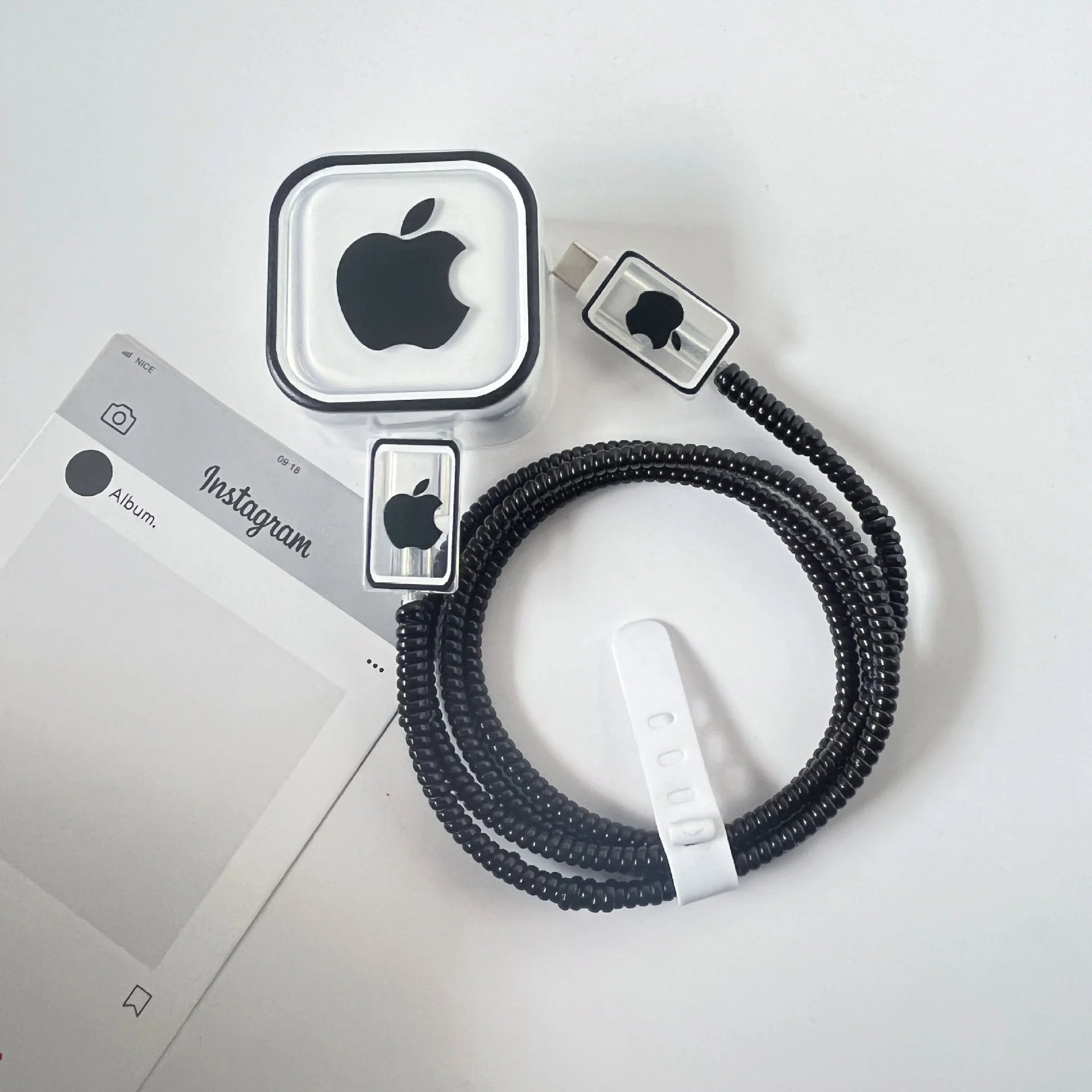 Apple Coiled Cable with Clear Housing and Logo Accents Black Phone Accessory