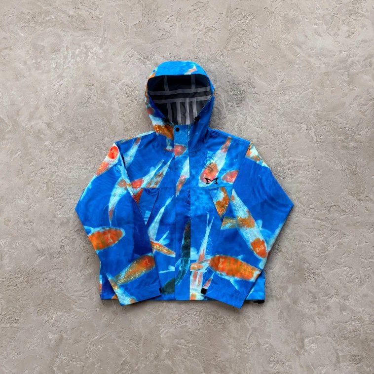 MUTA Jackets Hooded zip-up shell jacket with multiple zip pockets — Blue