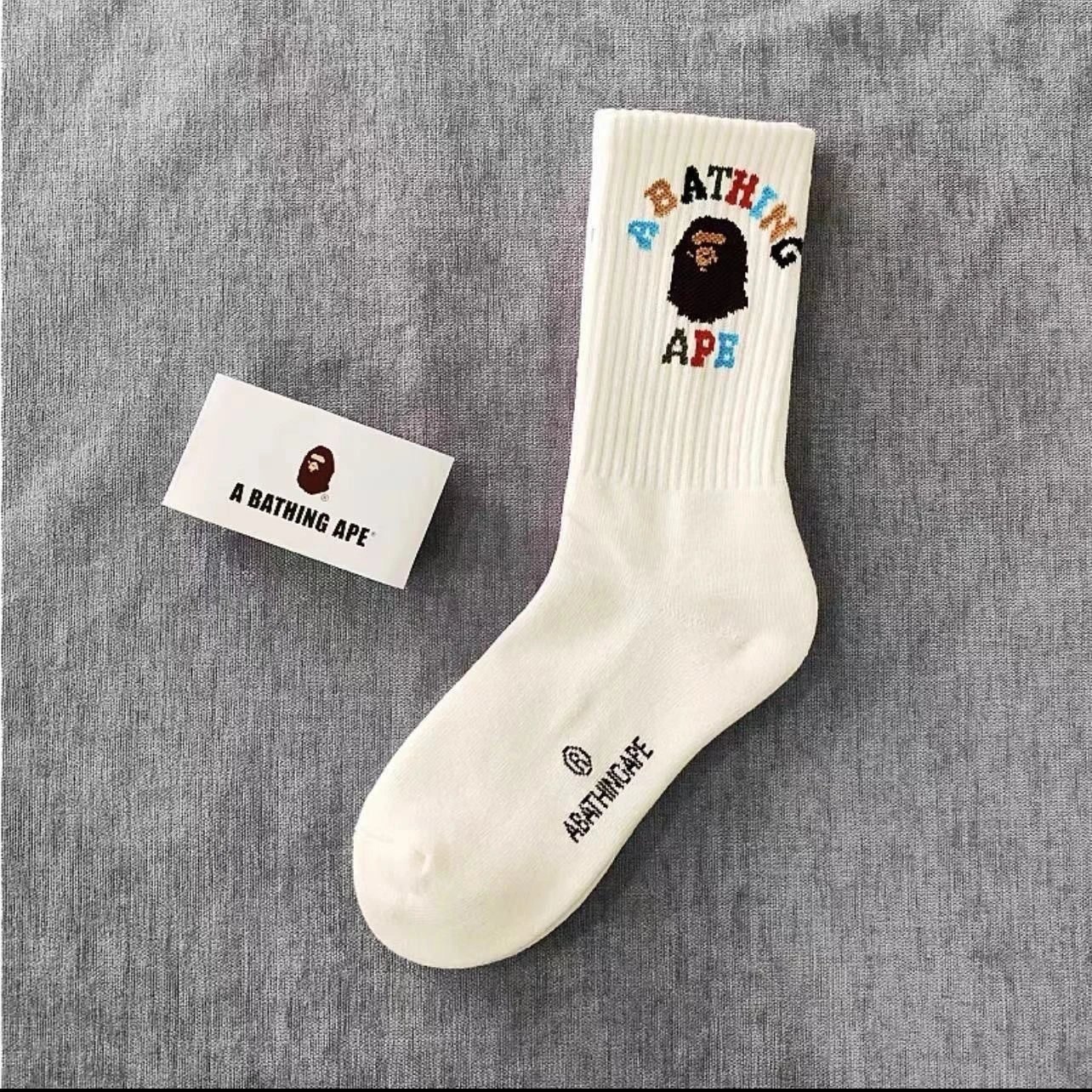 A Bathing Ape Socks Ribbed crew with logo graphics and striped cuffs — 27