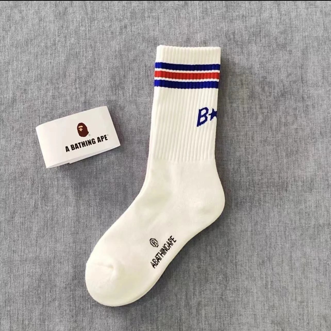 A Bathing Ape Socks Ribbed crew with logo graphics and striped cuffs — 17