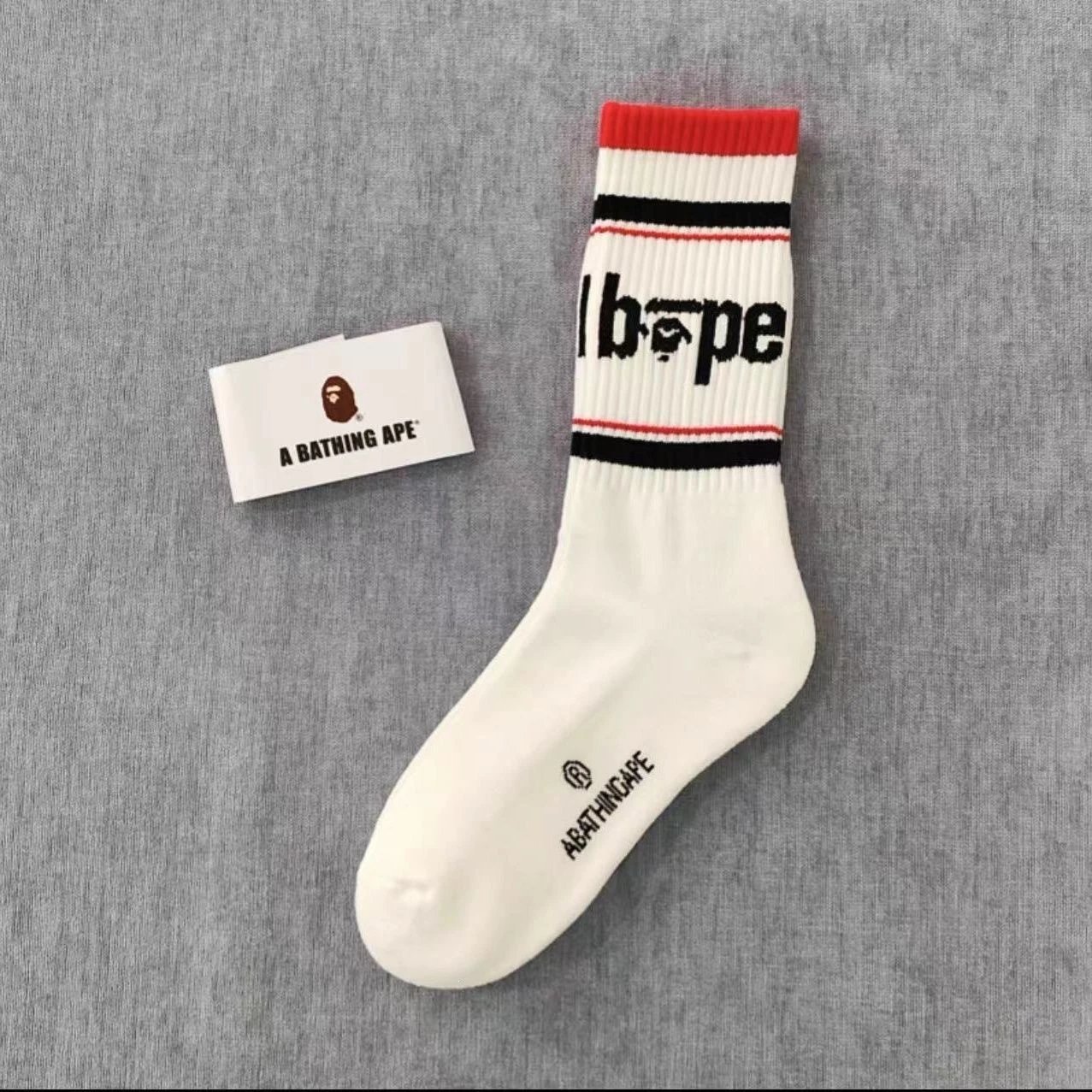 A Bathing Ape Socks Ribbed crew with logo graphics and striped cuffs — 25