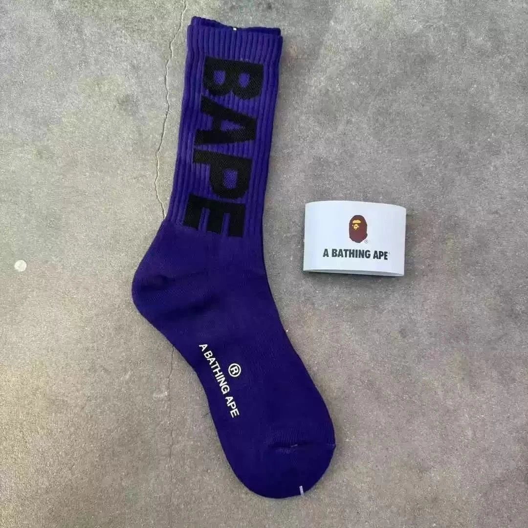 A Bathing Ape Socks Ribbed crew with logo graphics and striped cuffs — 39