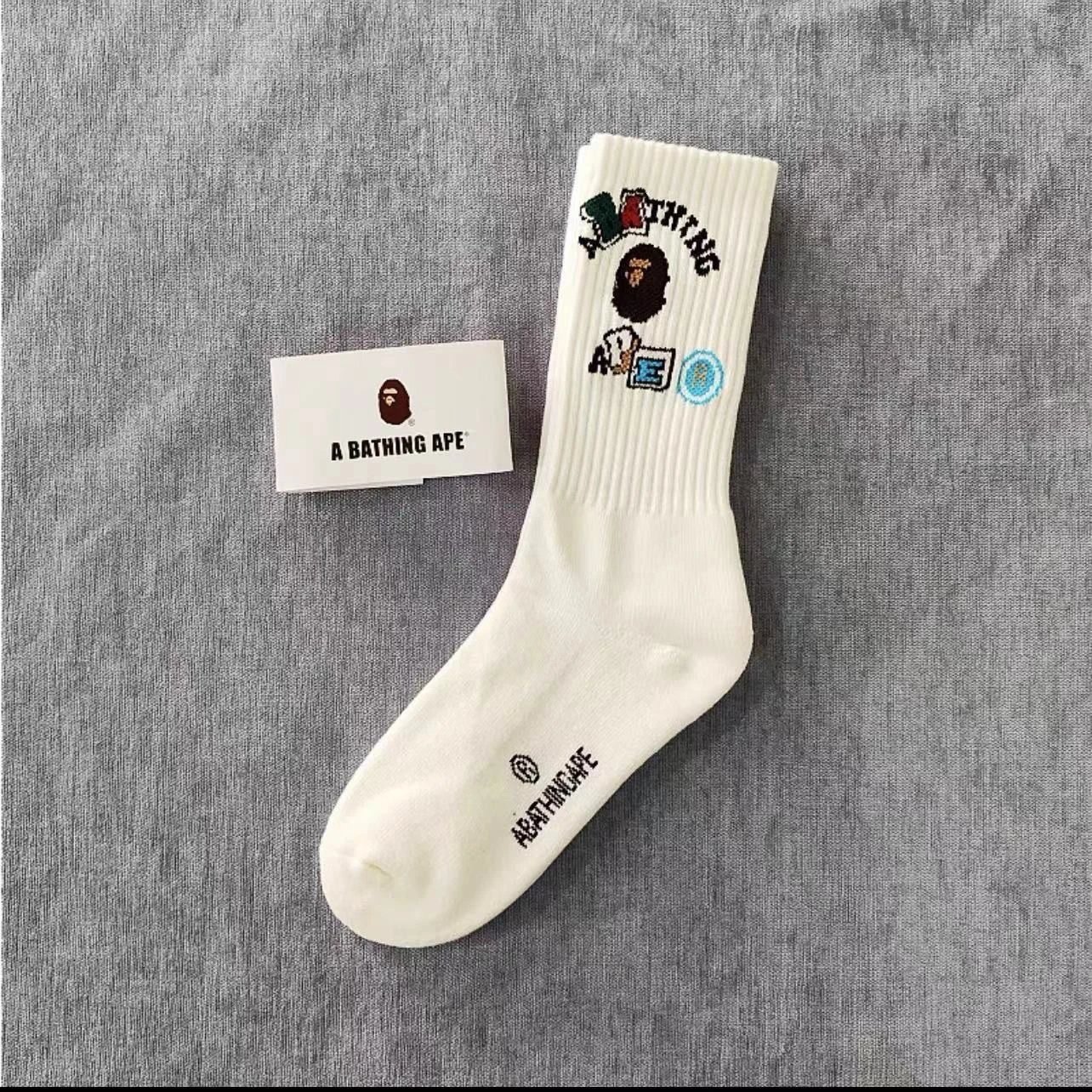 A Bathing Ape Socks Ribbed crew with logo graphics and striped cuffs — 29