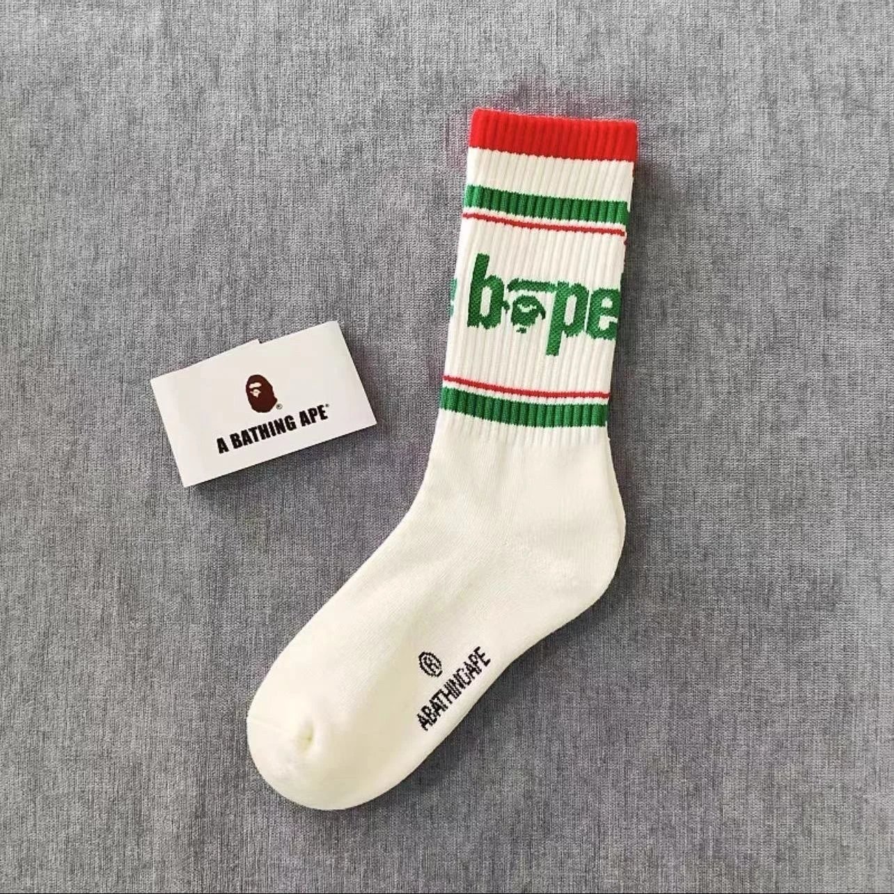 A Bathing Ape Socks Ribbed crew with logo graphics and striped cuffs — 22