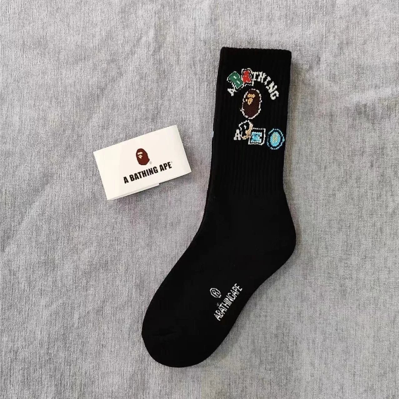 A Bathing Ape Socks Ribbed crew with logo graphics and striped cuffs — 30