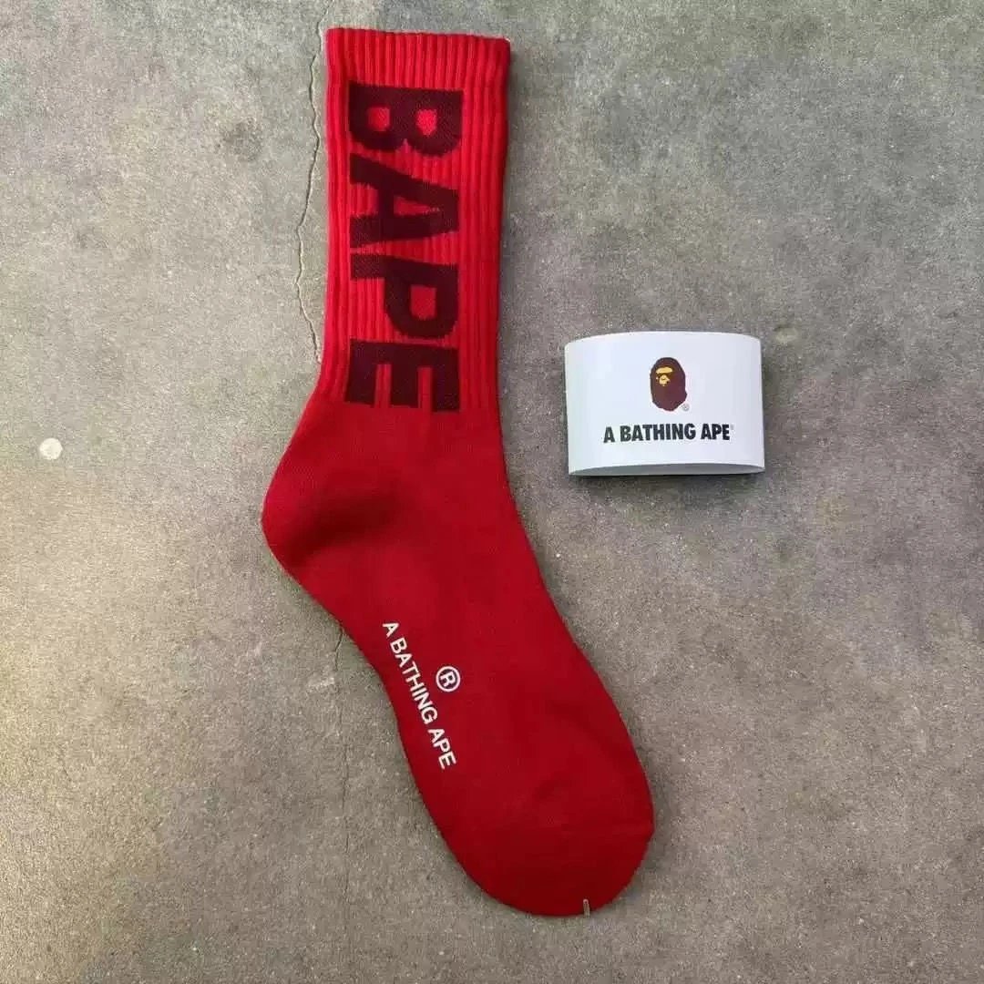 A Bathing Ape Socks Ribbed crew with logo graphics and striped cuffs — 38