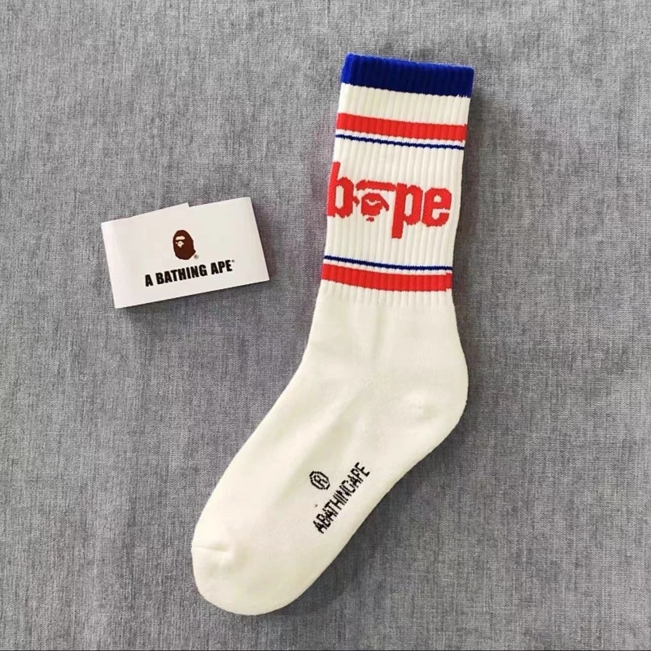 A Bathing Ape Socks Ribbed crew with logo graphics and striped cuffs — 24