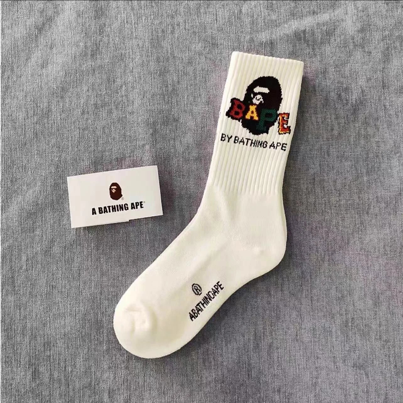 A Bathing Ape Socks Ribbed crew with logo graphics and striped cuffs — 32