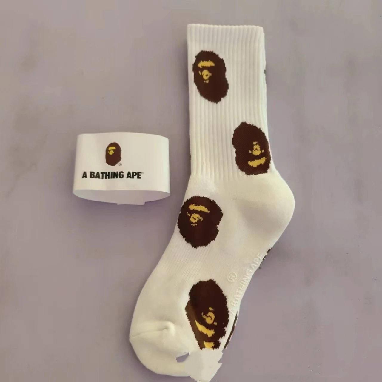 A Bathing Ape Socks Ribbed crew with logo graphics and striped cuffs — 40