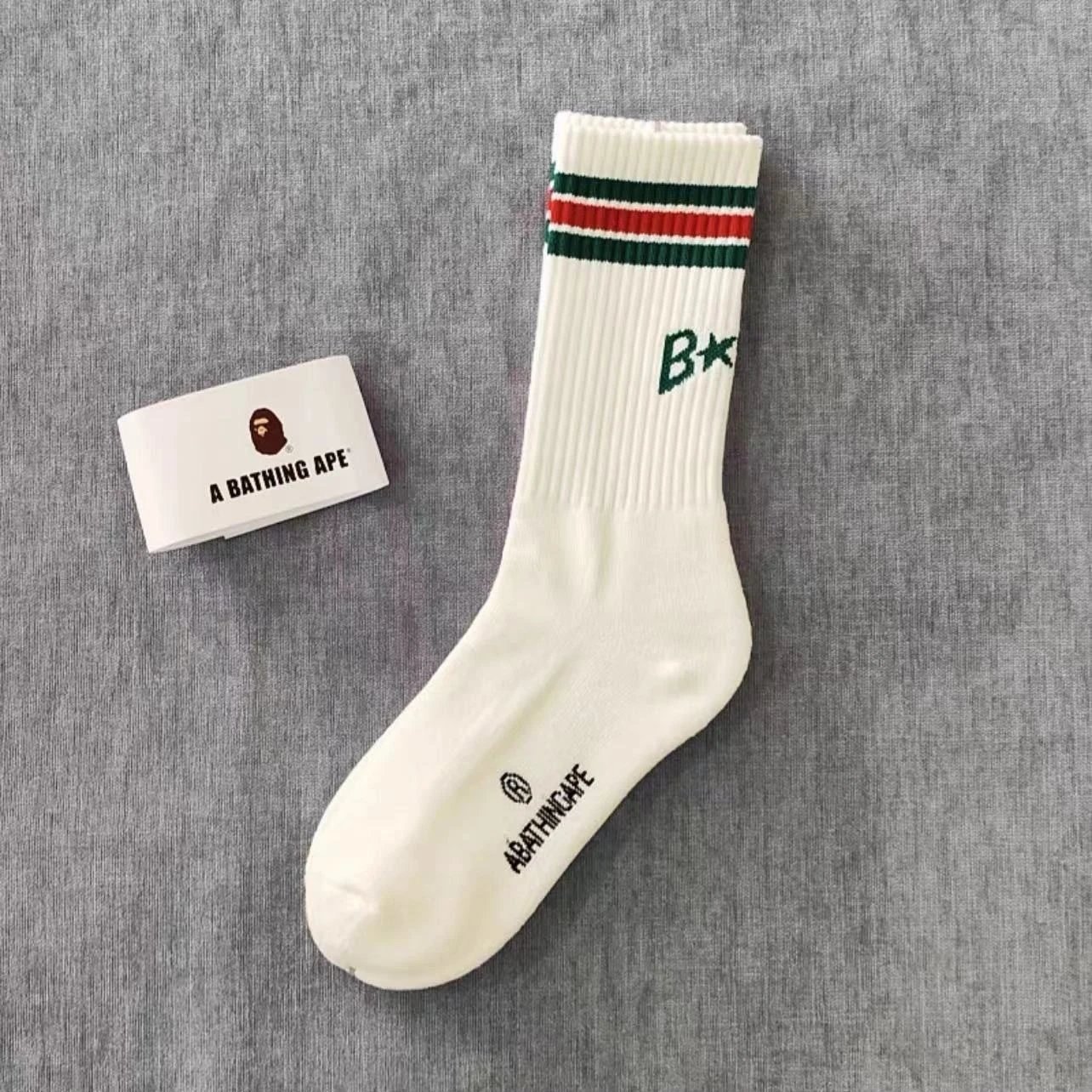 A Bathing Ape Socks Ribbed crew with logo graphics and striped cuffs — 18