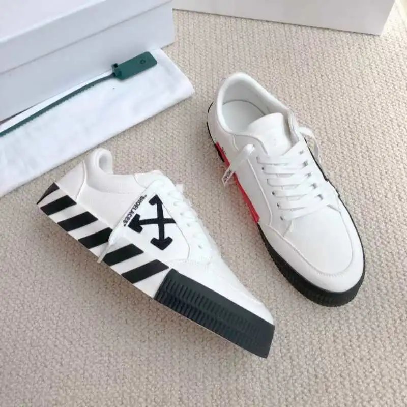 Off-White Sneakers Low-top with crossed-arrow graphic and striped sole — white and black zebra bottom