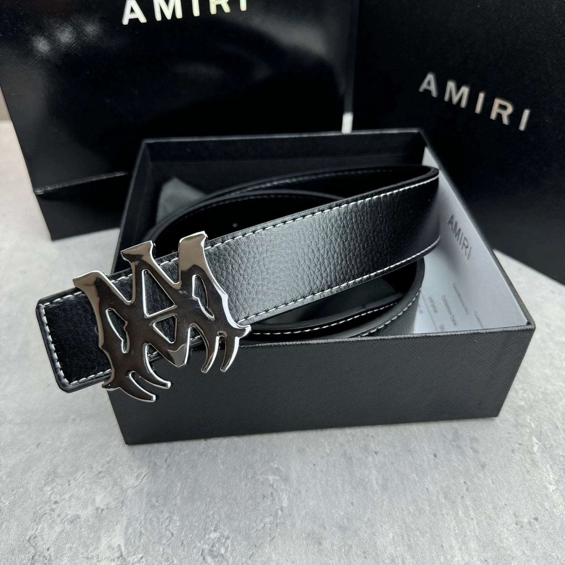 Black belt with a silver buckle SKU image