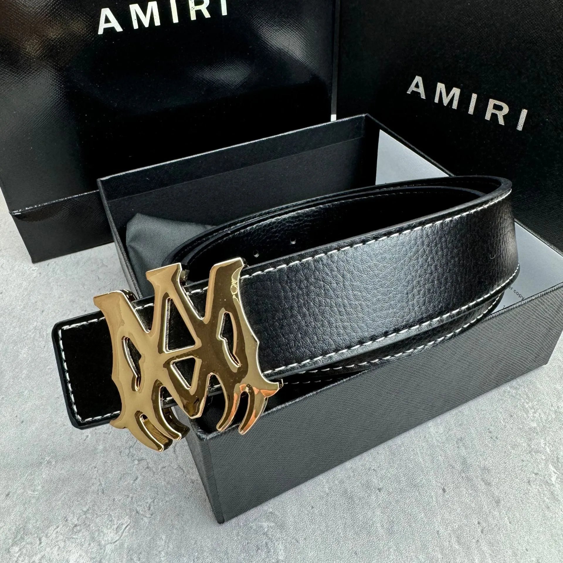 Black belt with a gold buckle SKU image