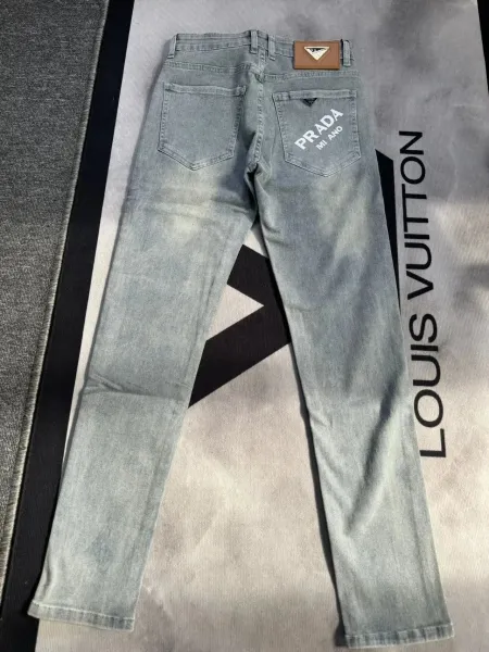 Prada x Miuccia Prada Logo-Print Light Wash Jeans - 1