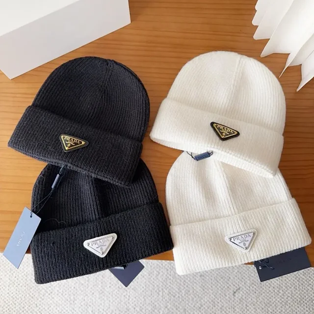 Prada Hats Ribbed knit beanie with triangle logo plaque product detail image 1
