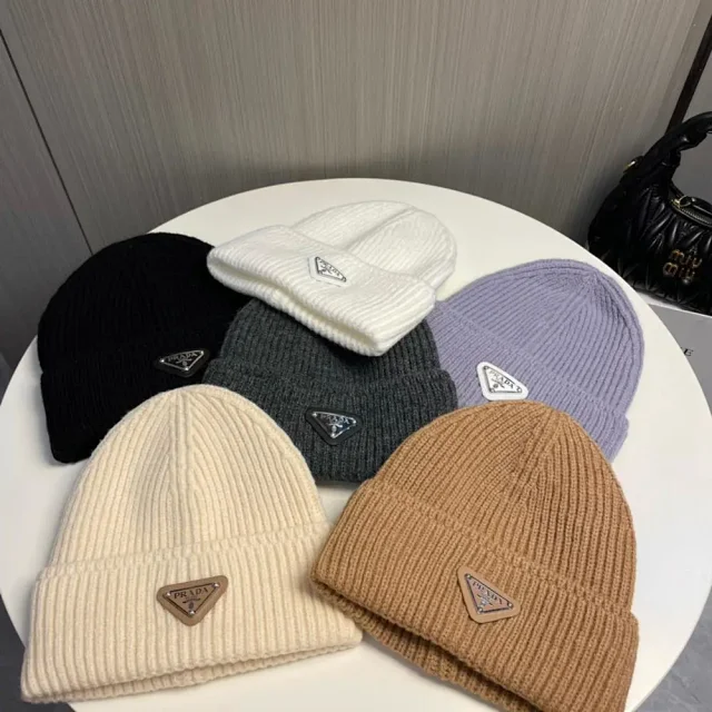 Prada Hats Ribbed knit beanie with triangle logo plaque product detail image 1