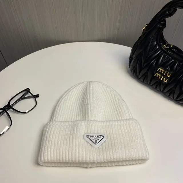 Prada Hats Ribbed knit beanie with triangle logo plaque product detail image 8