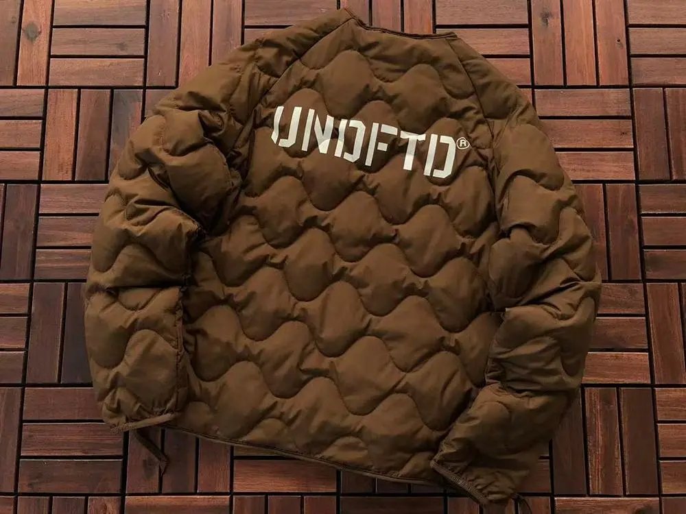 Undefeated Down Jackets Wavy-quilted logo puffer jacket image 6