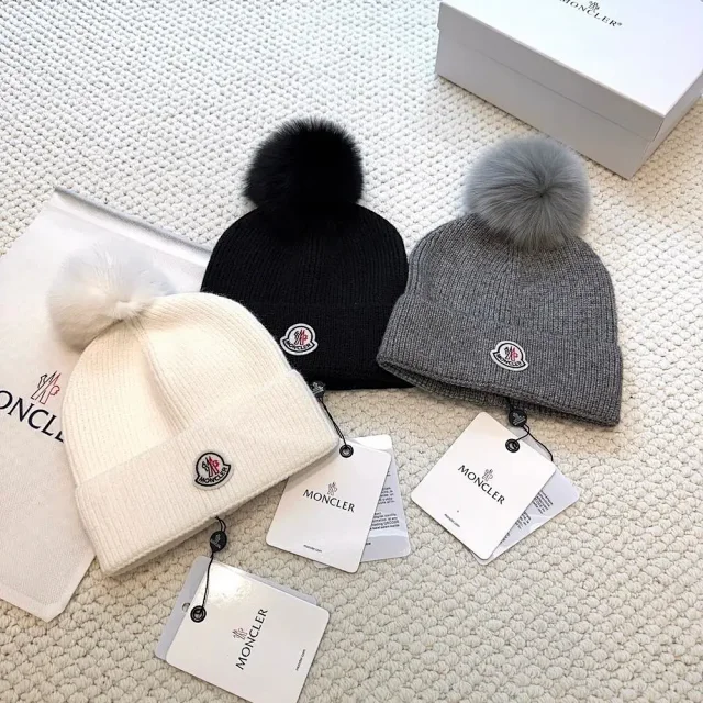 Moncler Hats Logo-patch rib-knit beanie with pom-pom and cable-knit variants product detail image 4