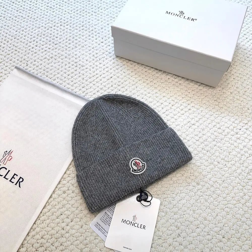 Moncler Hats Logo-patch rib-knit beanie with pom-pom and cable-knit variants — Style 2