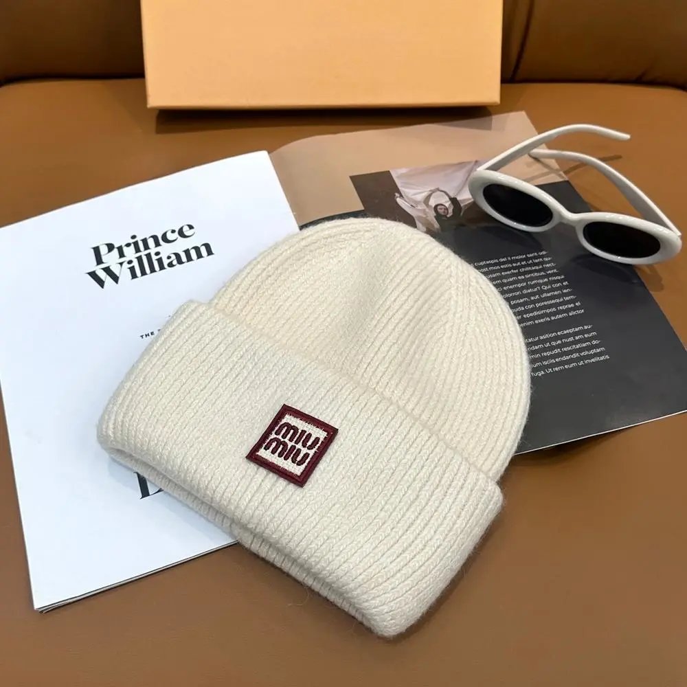 Miu Hats Rib-knit cuffed beanie with logo patch — Style 9