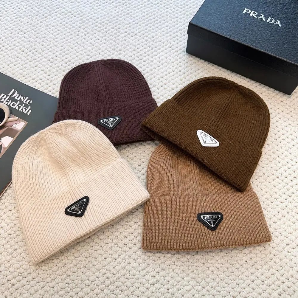 Prada Hats Ribbed knit beanie with triangular logo plaque — Style 4