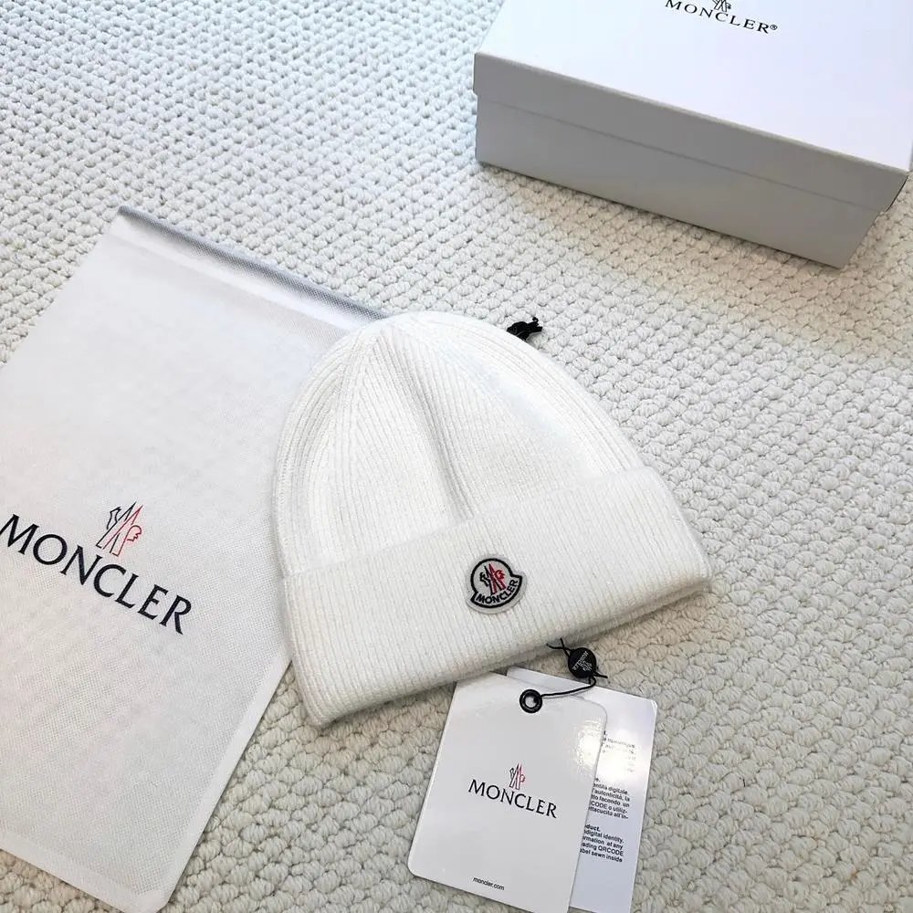 Moncler Hats Logo-patch rib-knit beanie with pom-pom and cable-knit variants — Style 3
