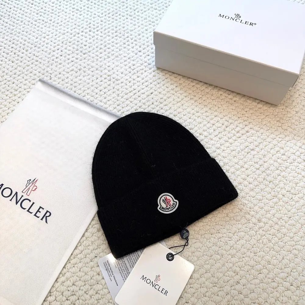 Moncler Hats Logo-patch rib-knit beanie with pom-pom and cable-knit variants — Style 4