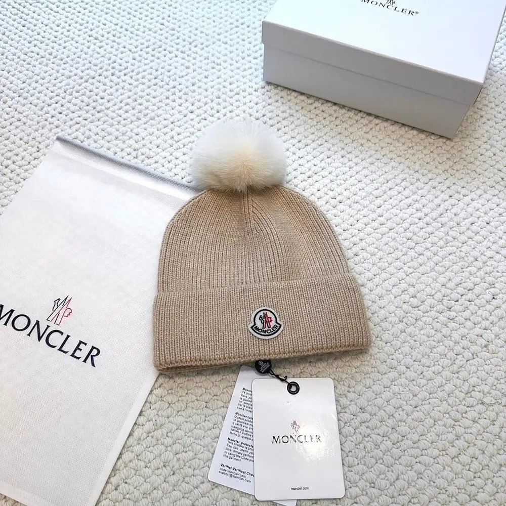 Moncler Hats Logo-patch rib-knit beanie with pom-pom and cable-knit variants — Style 12