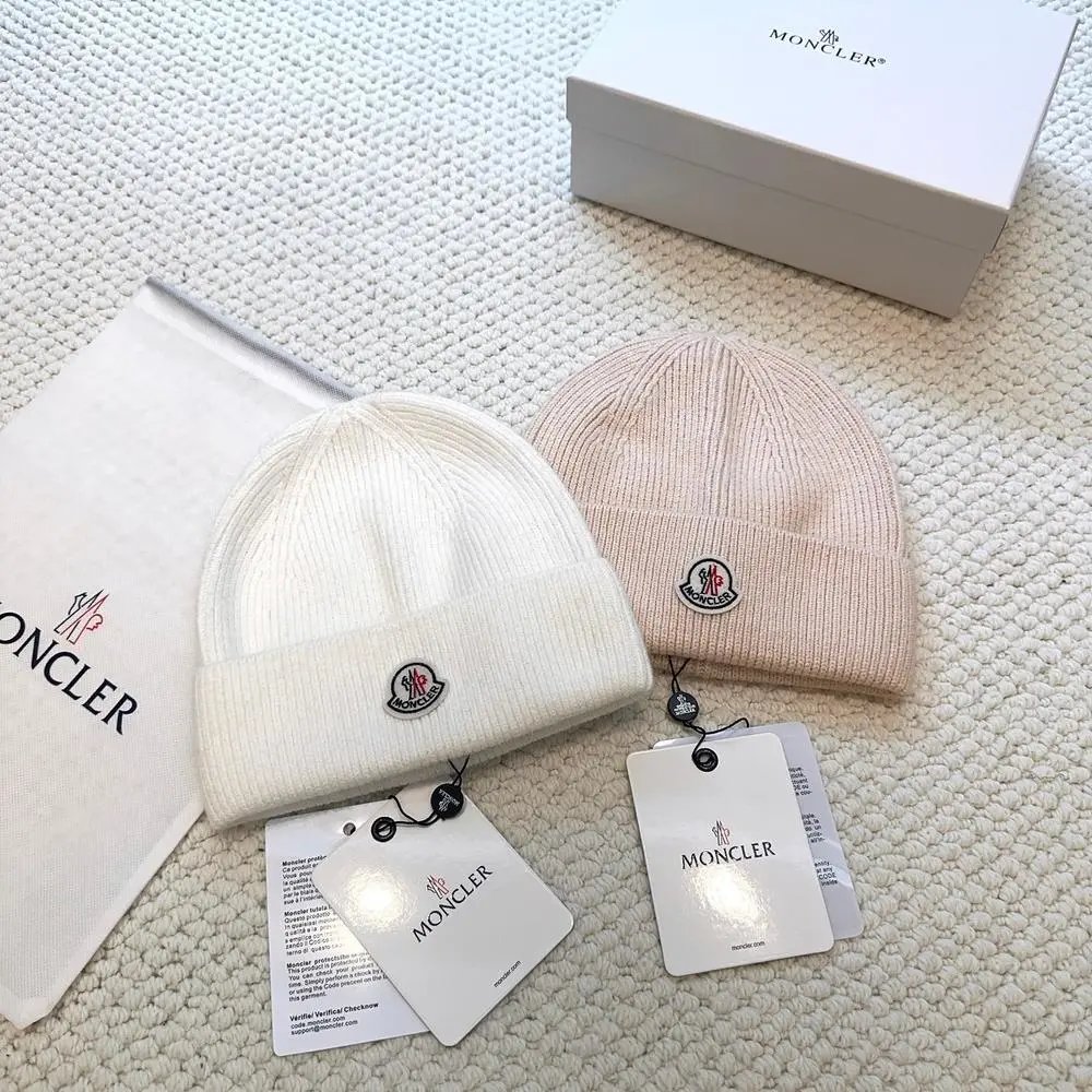 Moncler Hats Logo-patch rib-knit beanie with pom-pom and cable-knit variants image 9