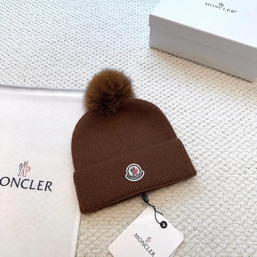 Moncler Hats Logo-patch rib-knit beanie with pom-pom and cable-knit variants — Style 7