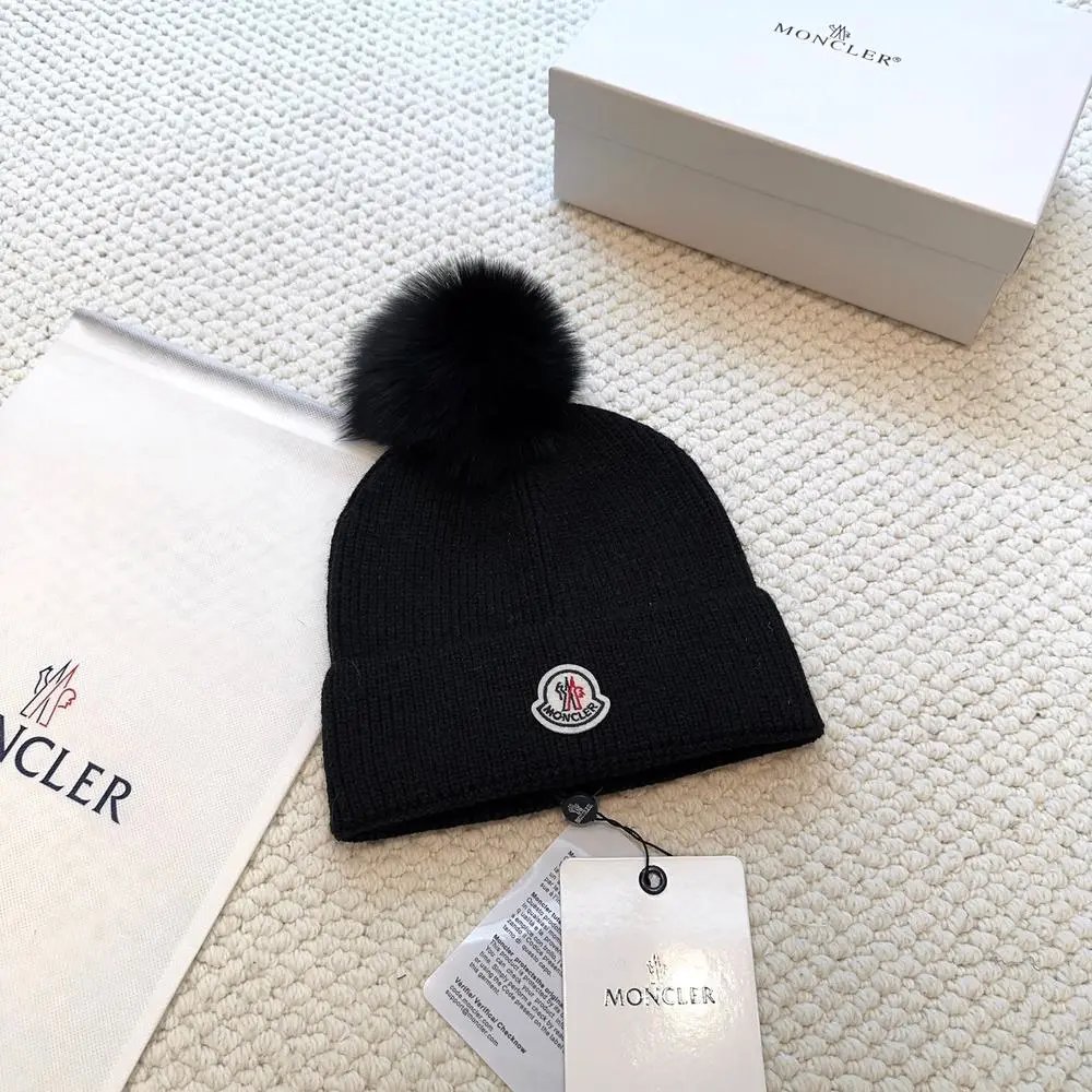 Moncler Hats Logo-patch rib-knit beanie with pom-pom and cable-knit variants — Style 15