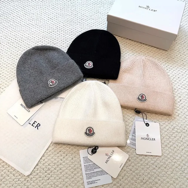 Moncler Hats Logo-patch rib-knit beanie with pom-pom and cable-knit variants product detail image 3