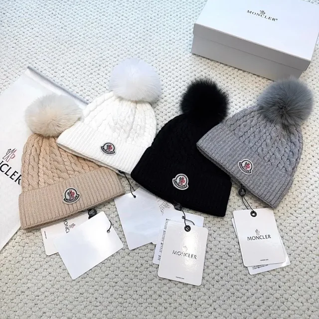 Moncler Hats Logo-patch rib-knit beanie with pom-pom and cable-knit variants product detail image 2