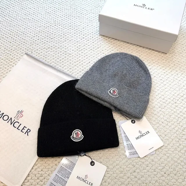 Moncler Hats Logo-patch rib-knit beanie with pom-pom and cable-knit variants product detail image 10