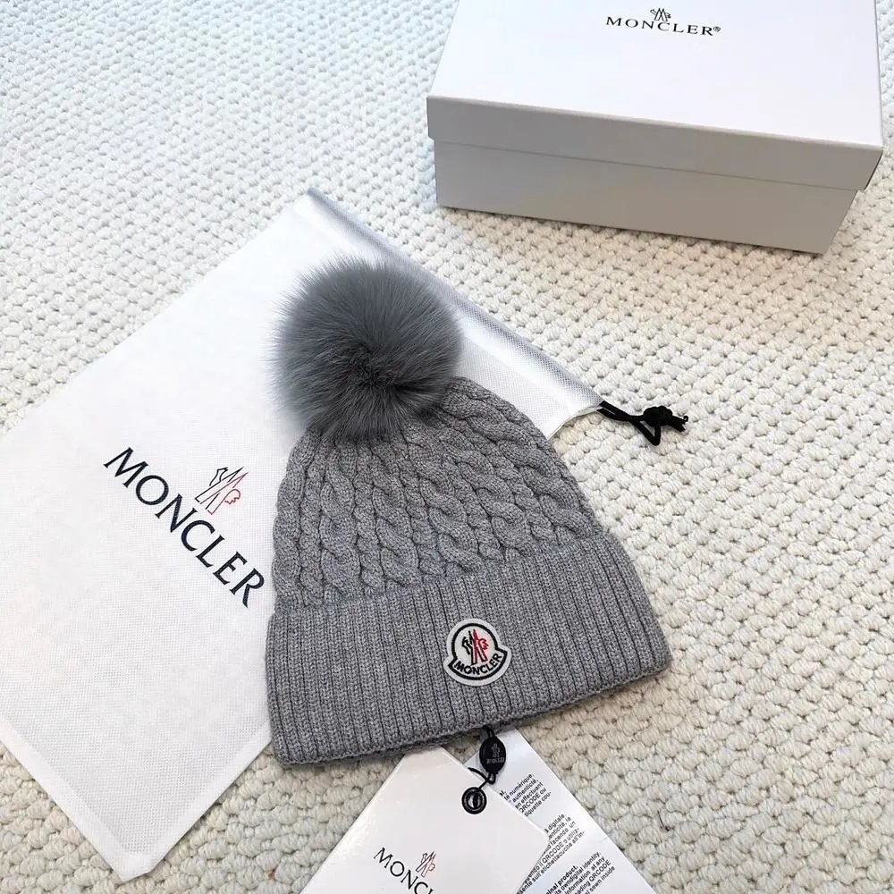Moncler Hats Logo-patch rib-knit beanie with pom-pom and cable-knit variants — Style 16