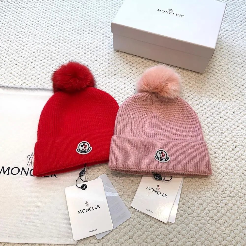 Moncler Hats Logo-patch rib-knit beanie with pom-pom and cable-knit variants image 8