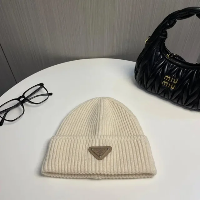Prada Hats Ribbed knit beanie with triangle logo plaque product detail image 4