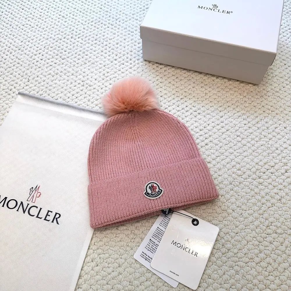 Moncler Hats Logo-patch rib-knit beanie with pom-pom and cable-knit variants — Style 13