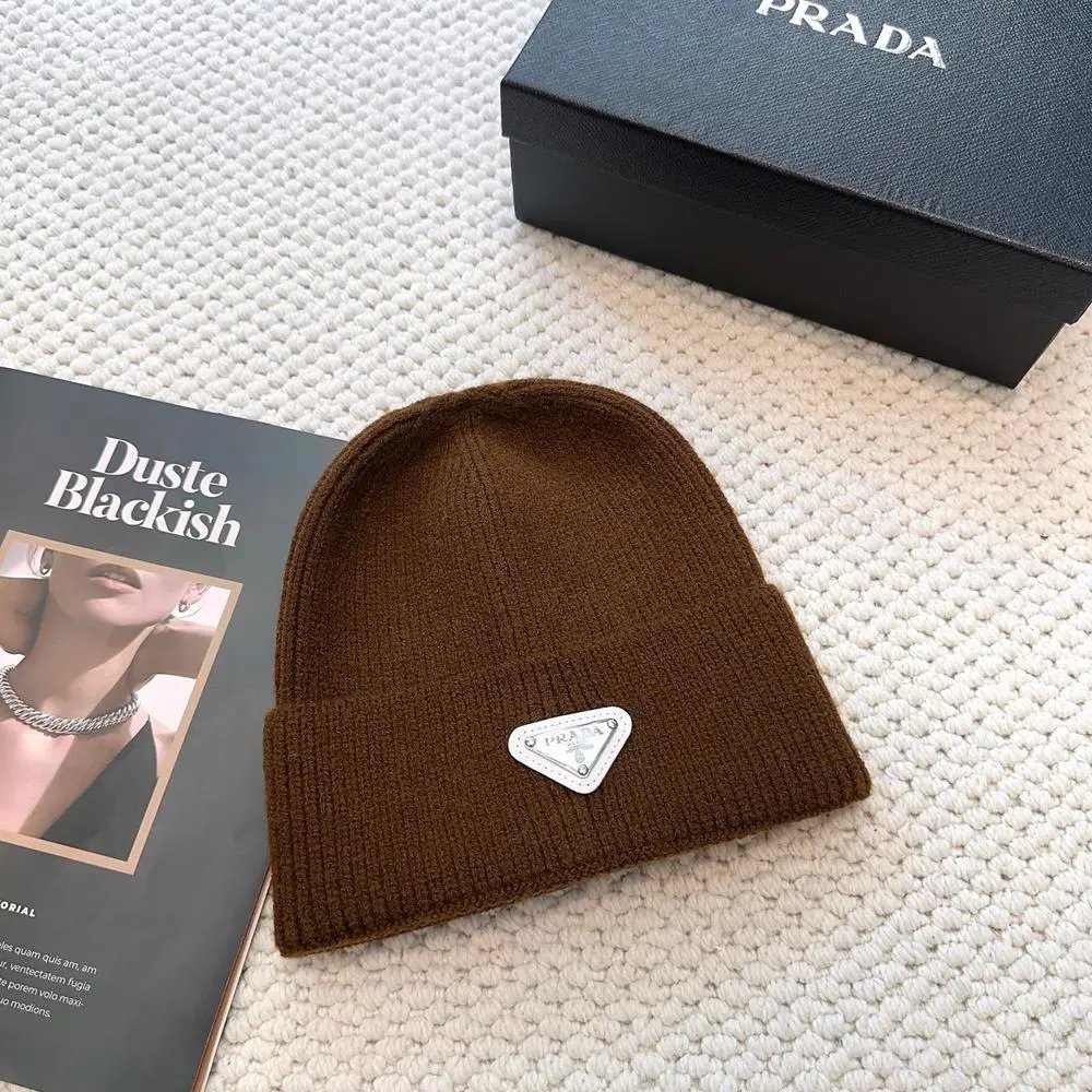 Prada Hats Ribbed knit beanie with triangular logo plaque — Style 6