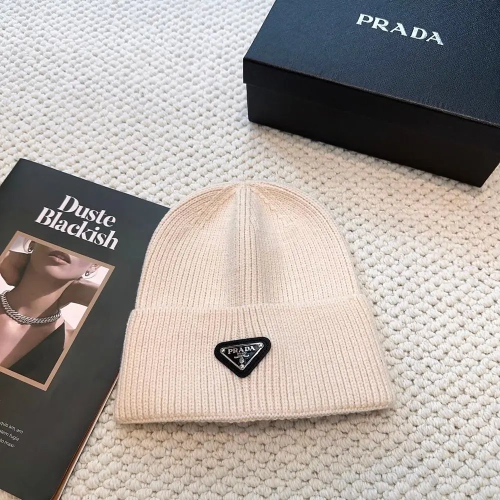Prada Hats Ribbed knit beanie with triangular logo plaque — Style 9
