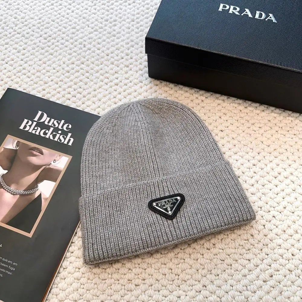 Prada Hats Ribbed knit beanie with triangular logo plaque — Style 3