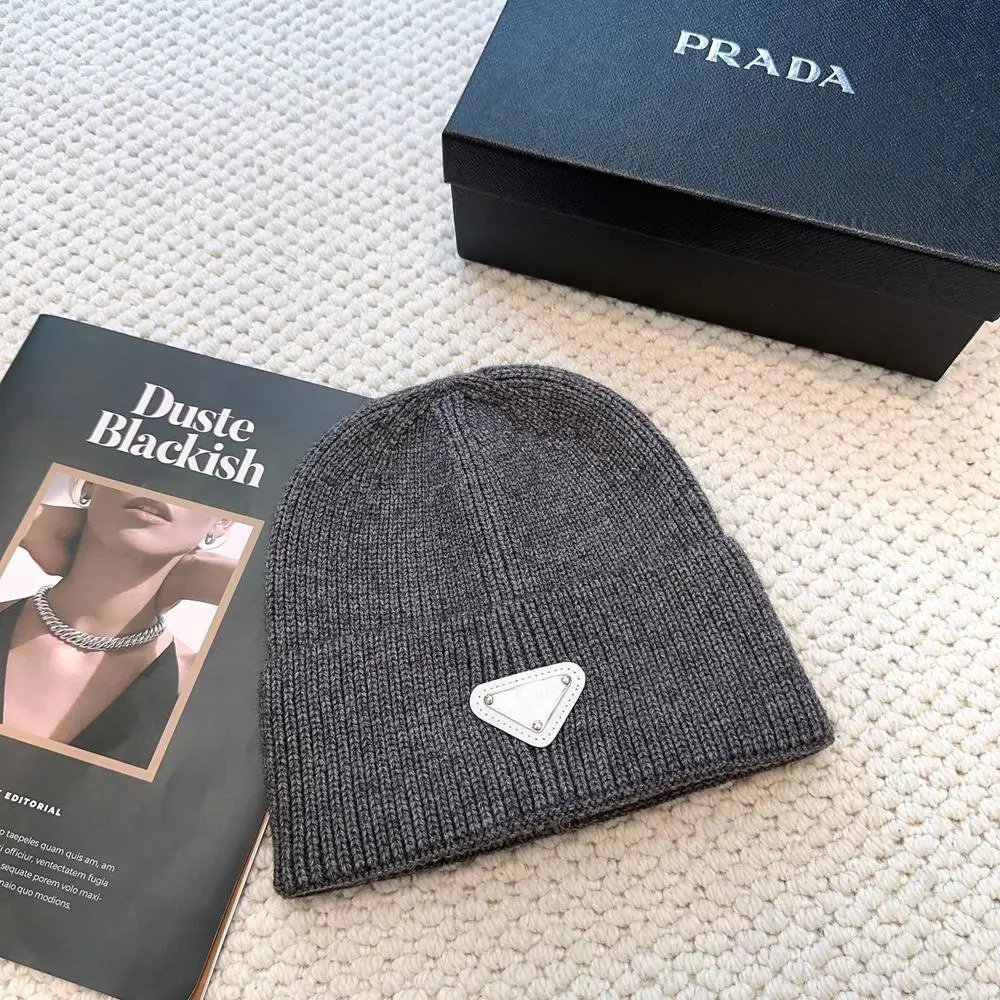Prada Hats Ribbed knit beanie with triangular logo plaque — Style 10