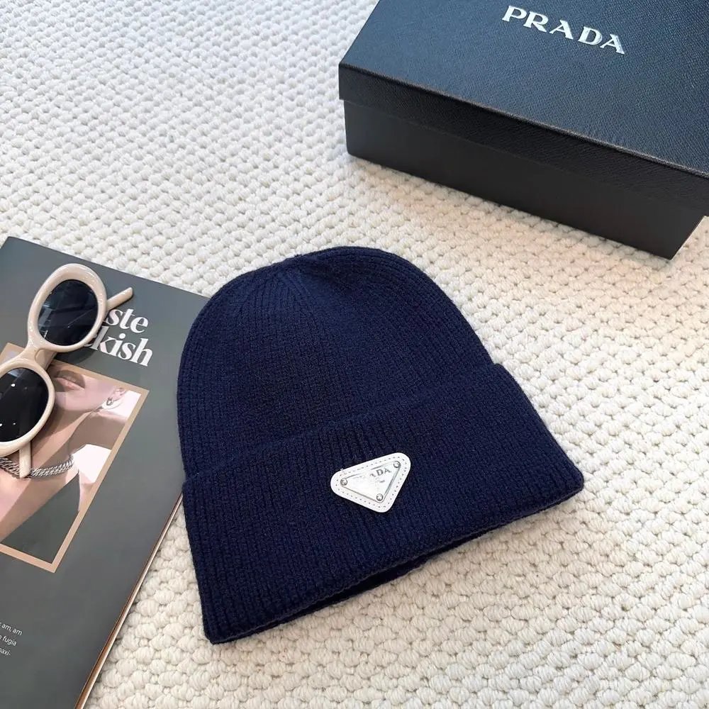 Prada Hats Ribbed knit beanie with triangular logo plaque — Style 8