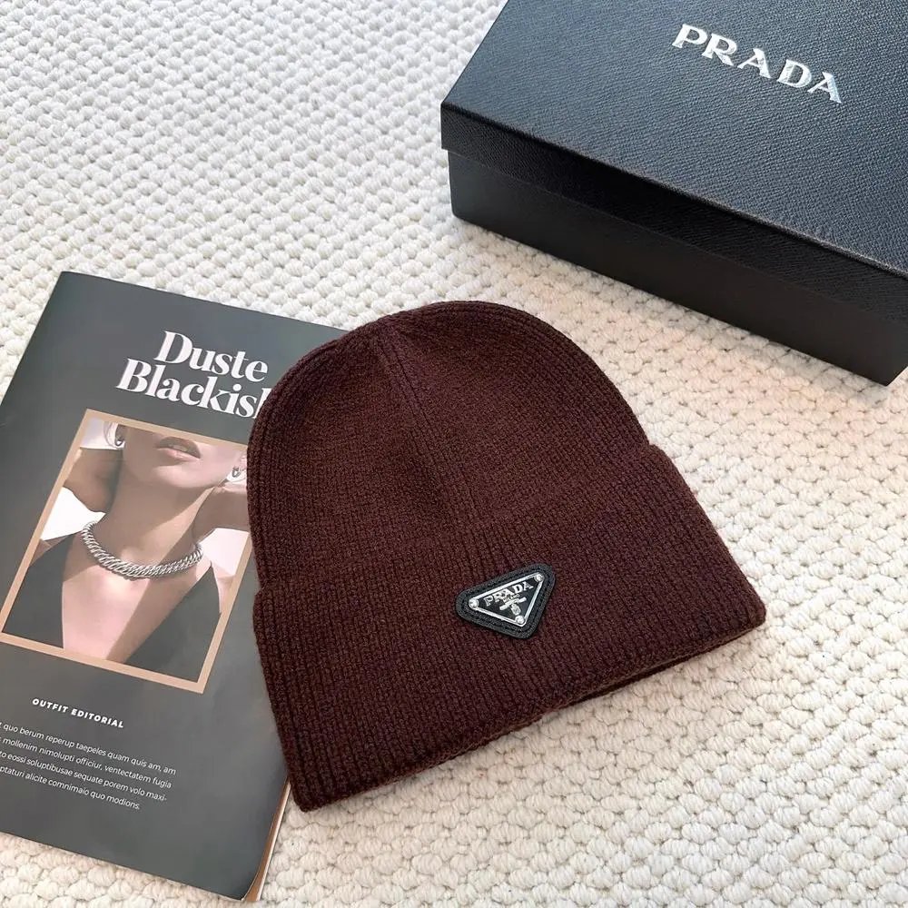 Prada Hats Ribbed knit beanie with triangular logo plaque — Style 7