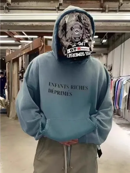 Enfants Riches Déprimés Hoodie in Washed Blue with Printed Face Mask - 1