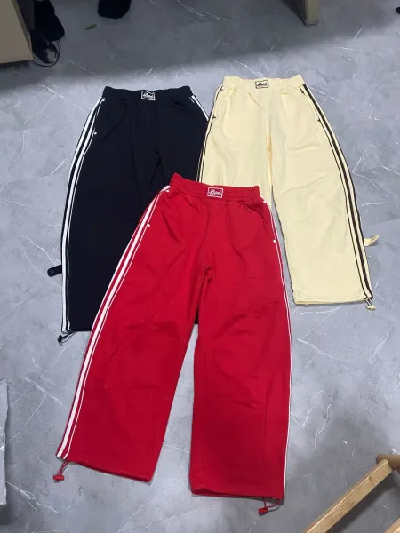 Babu Track Pants in Red, Black, and Beige - 1