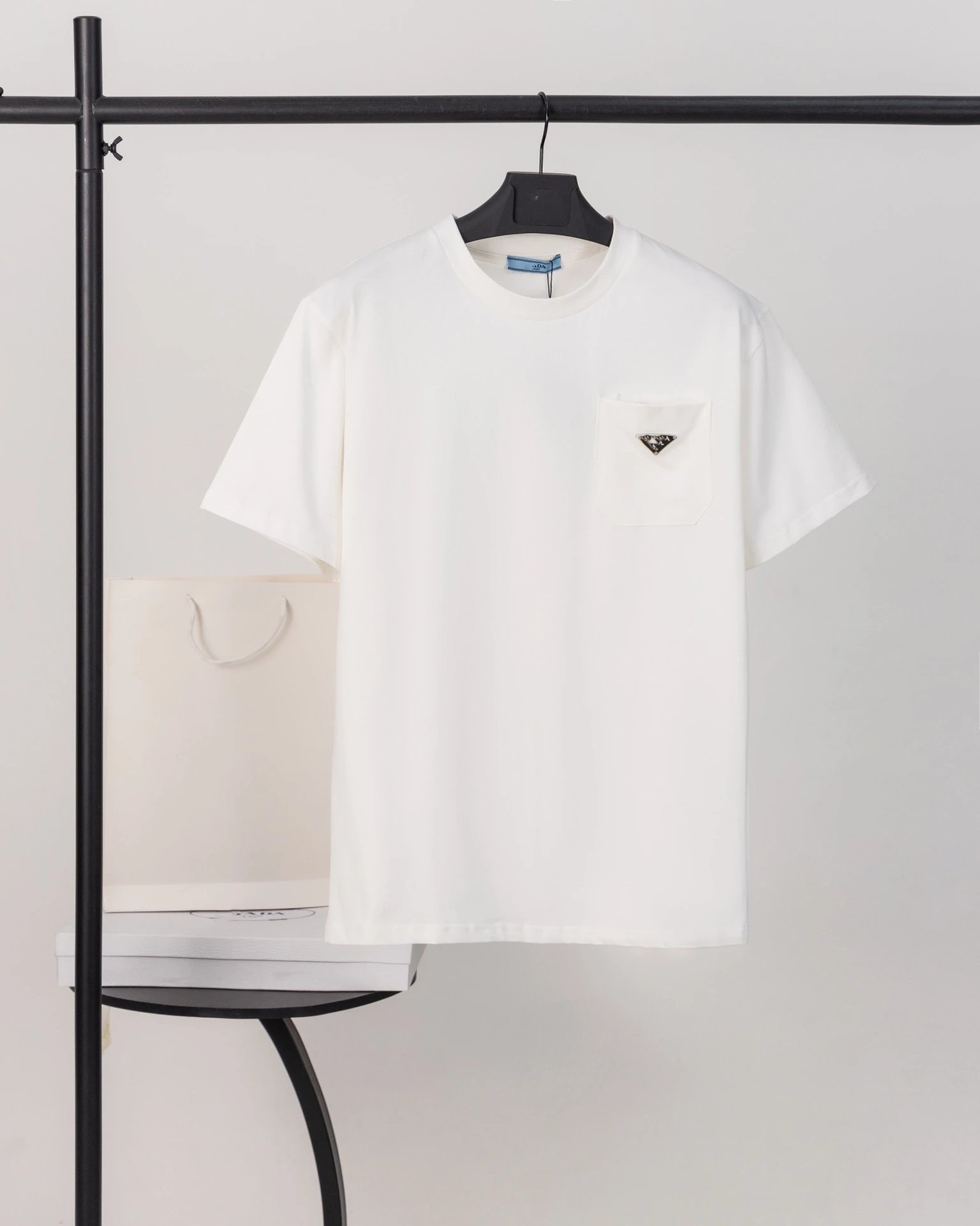 Prada T-Shirts Crew-neck T-shirt with triangular logo plaque — White triangular-pocketed