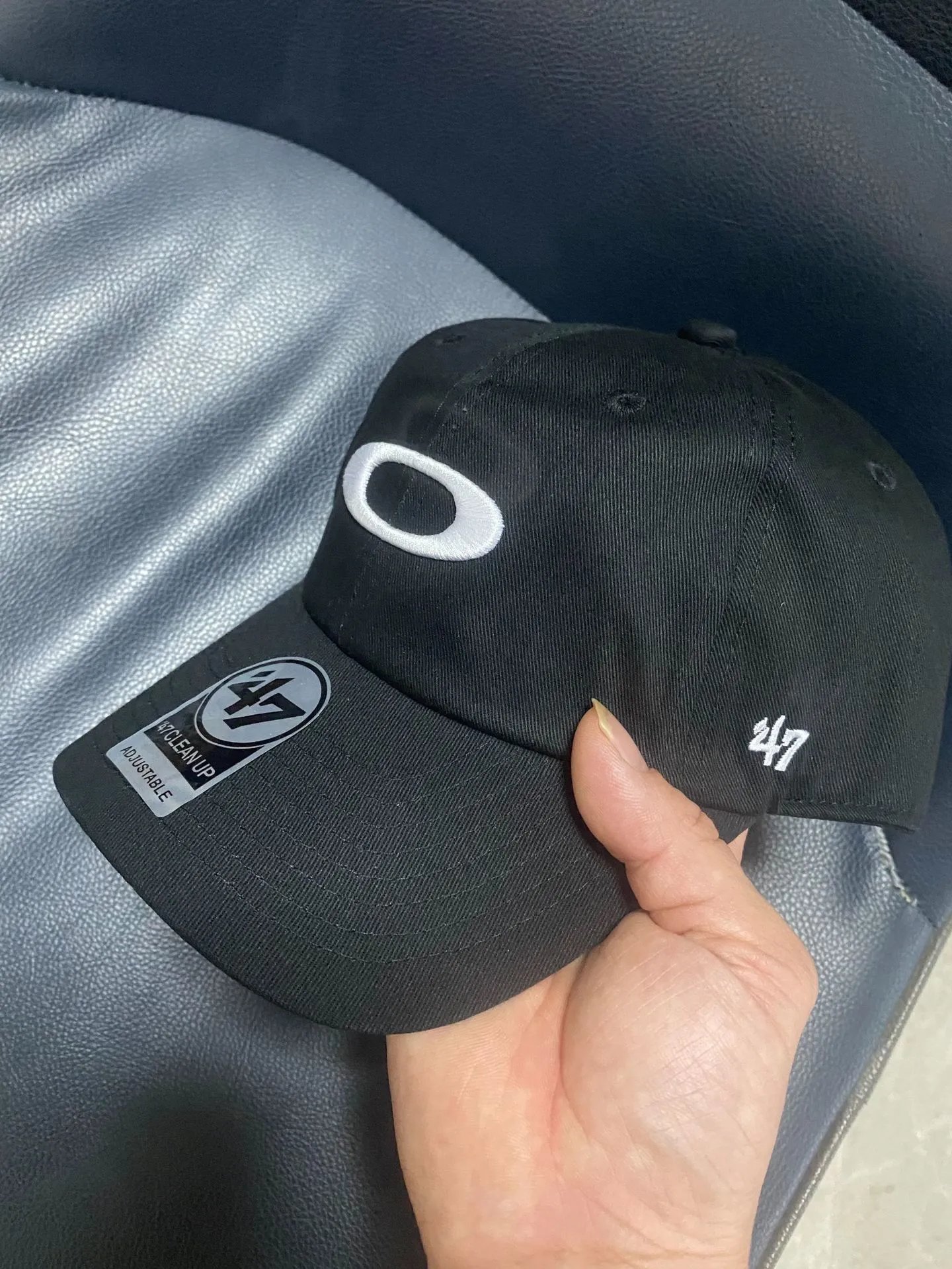 Oakley Hats Baseball Cap with Embroidered Ellipse Logo — Black with a white label