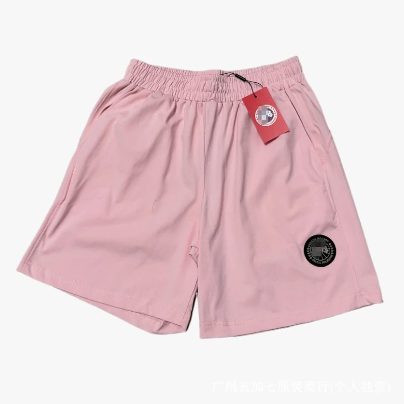 Canada Goose Matching Sets Logo-Patch T-Shirt and Shorts Set — Pink pants with a black label